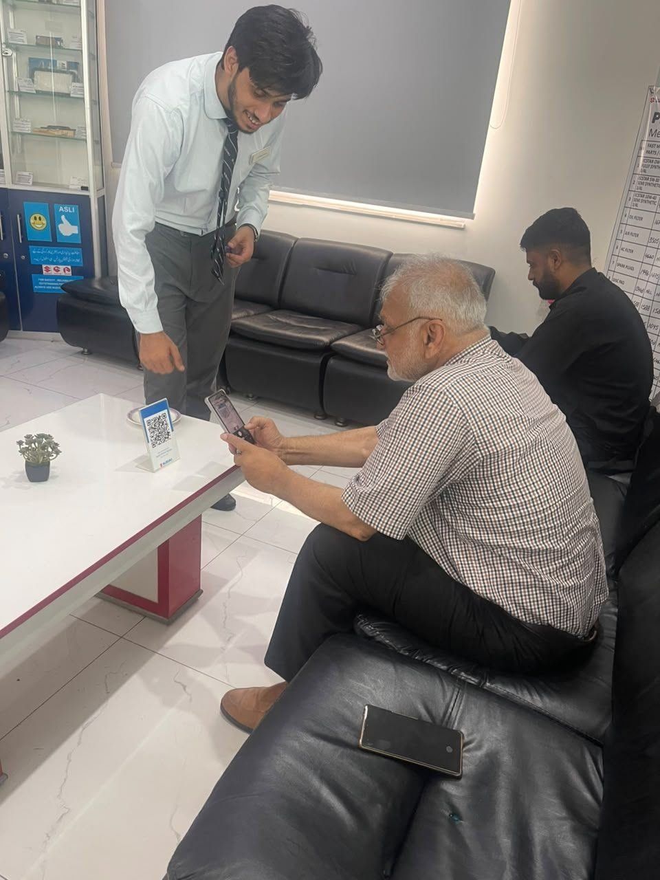 Suzuki Premier Motors showroom floor, Lahore — new Suzuki vehicles on display