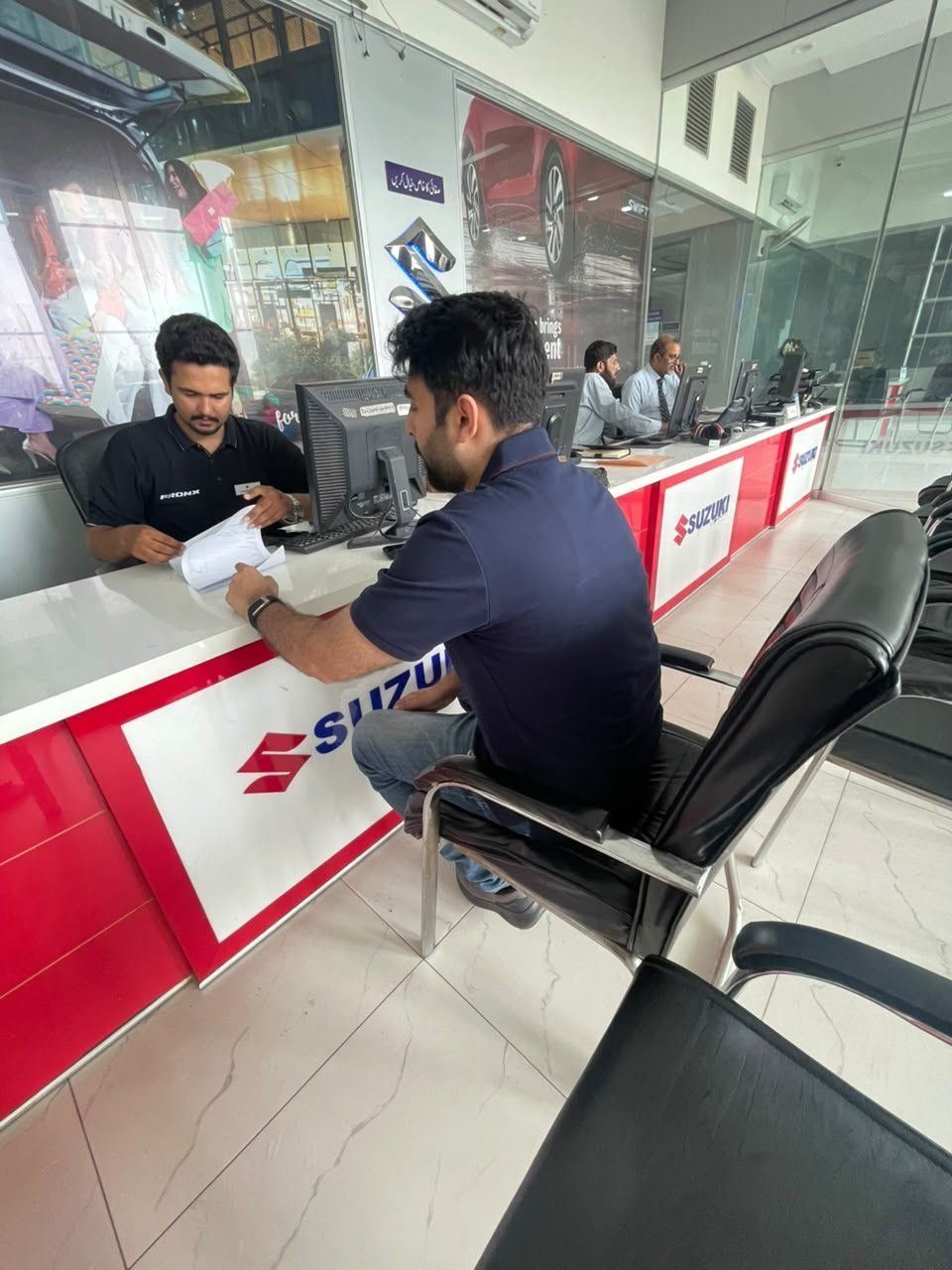 Suzuki Premier Motors sales floor with latest Suzuki models Lahore